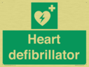 green-background-with-white-text-and-heart-defibrillator-symbol--white-cross-and~
